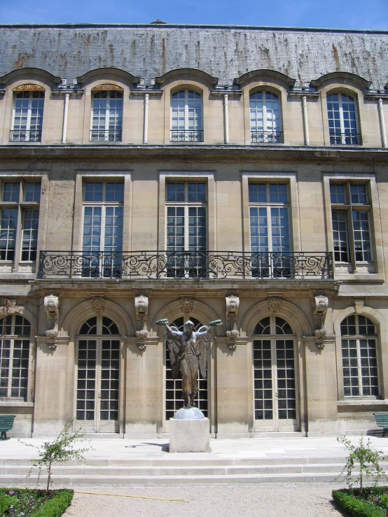 an elegantly decorated building with a statue and stairs