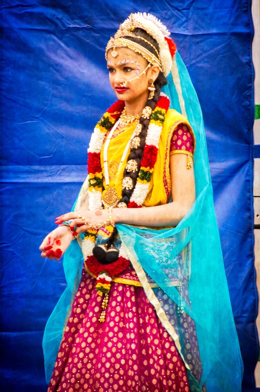 an indian dancer performs a dance for the audience