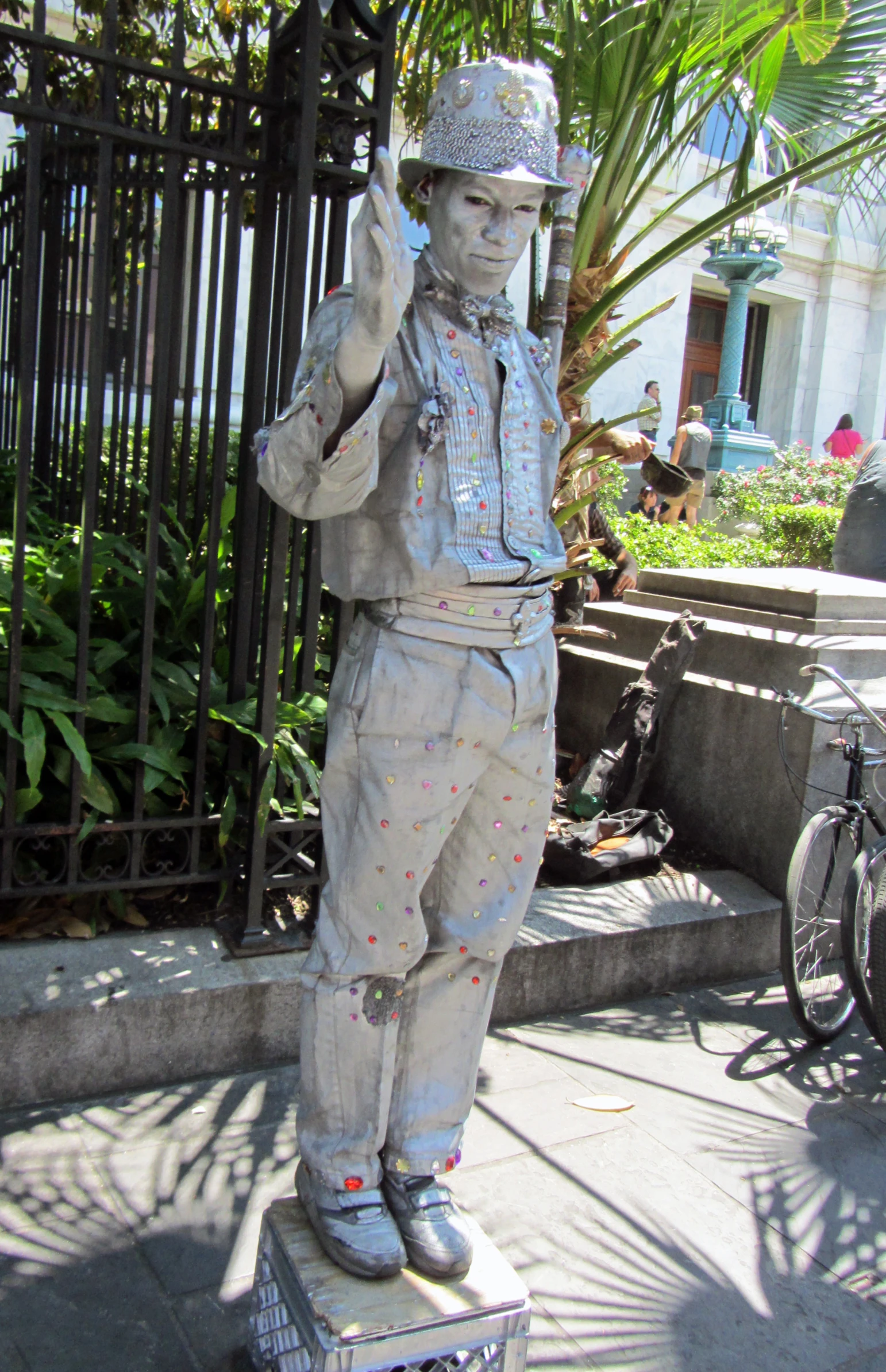 a sculpture in the shape of a policeman near a fence