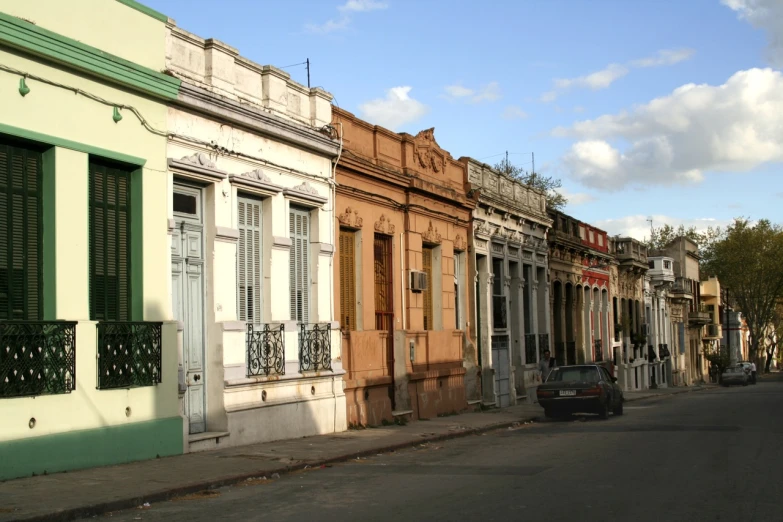 a street with some cars parked on the side