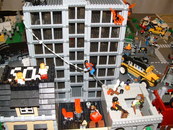 an overview of a lego city from above with people playing outside