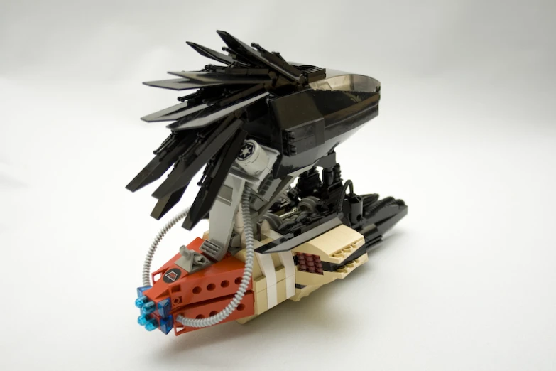 lego bird with feathers on its head is shown