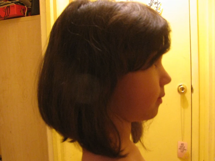 a woman's shoulder is shown with long hair