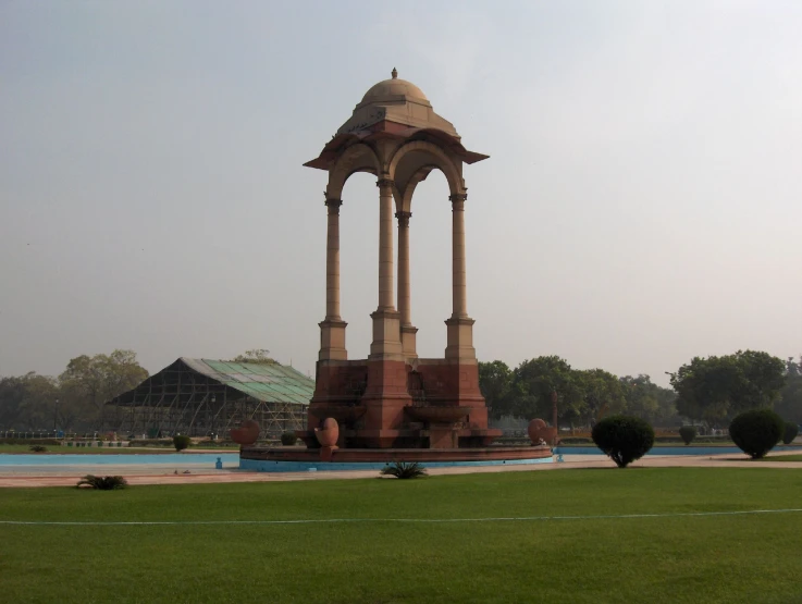 this large water fountain is situated near the building