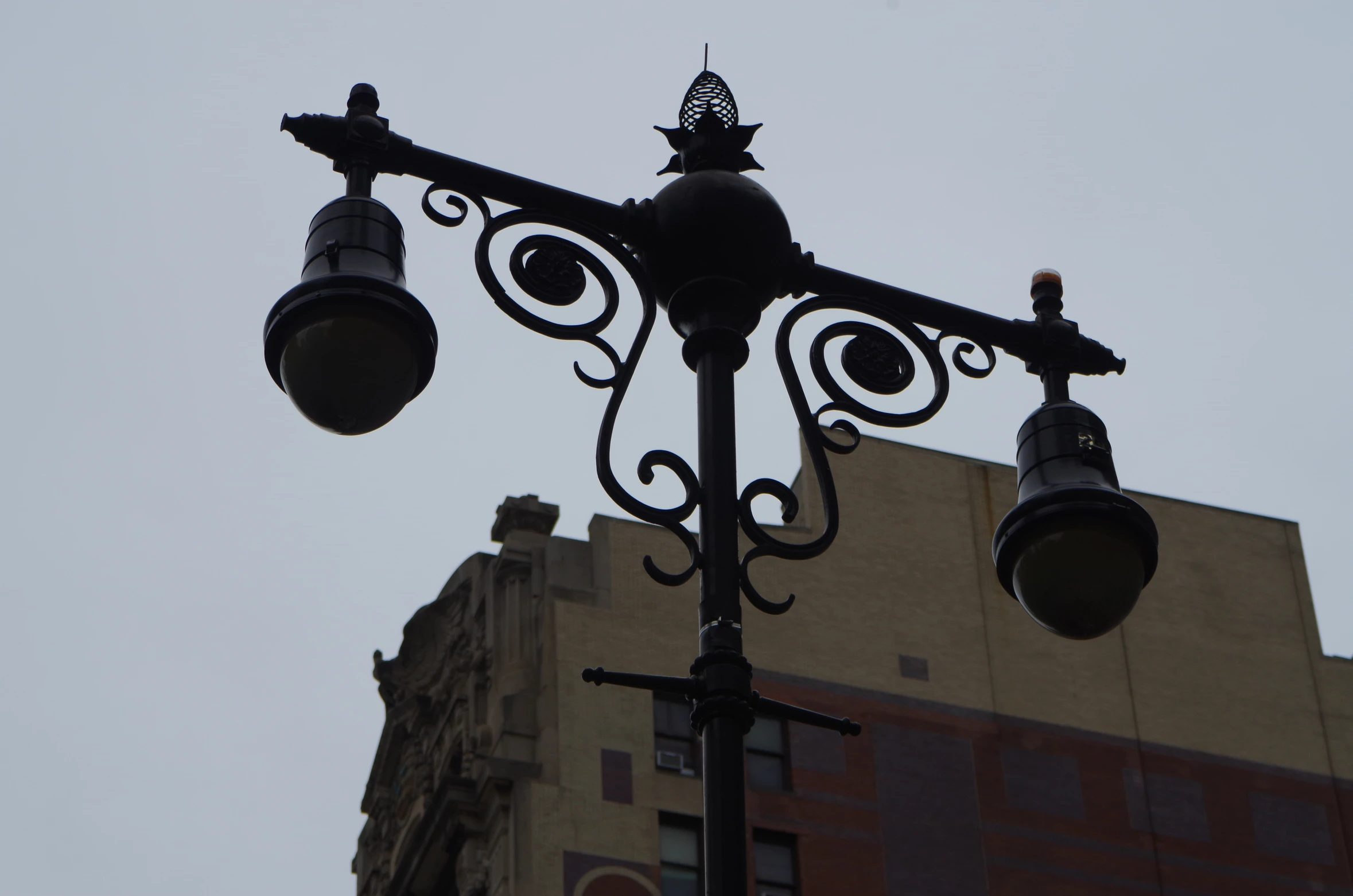 a street lamp that is on top of a metal pole