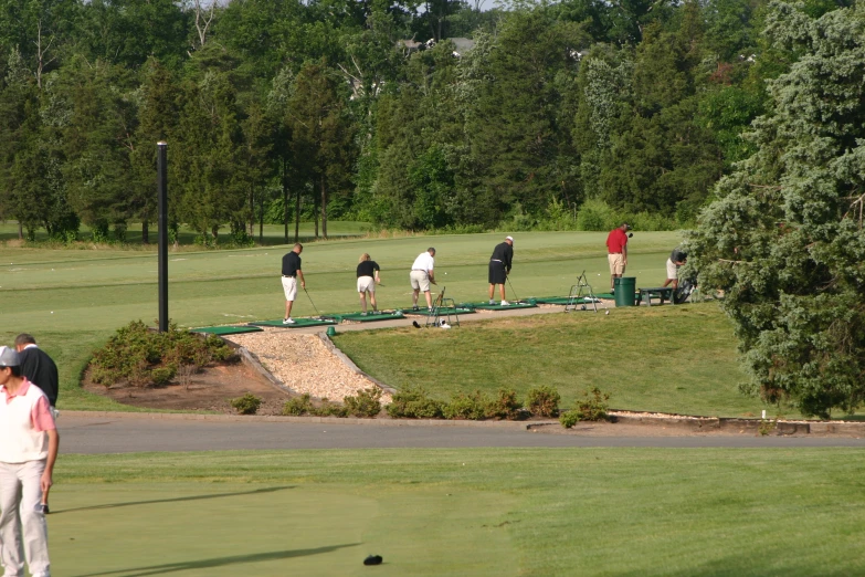 a golf game takes place as the first tee line is up