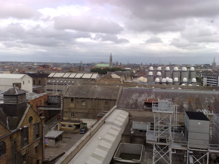 an overview of a city with a train on the tracks