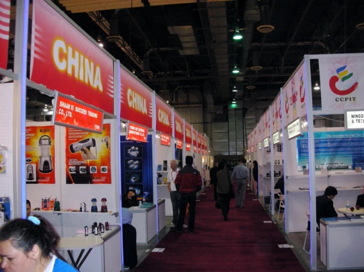 a display area with many booths with people inside
