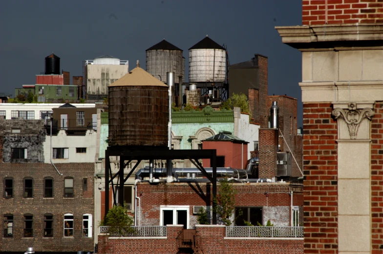 old buildings are shown and a building with chimneys