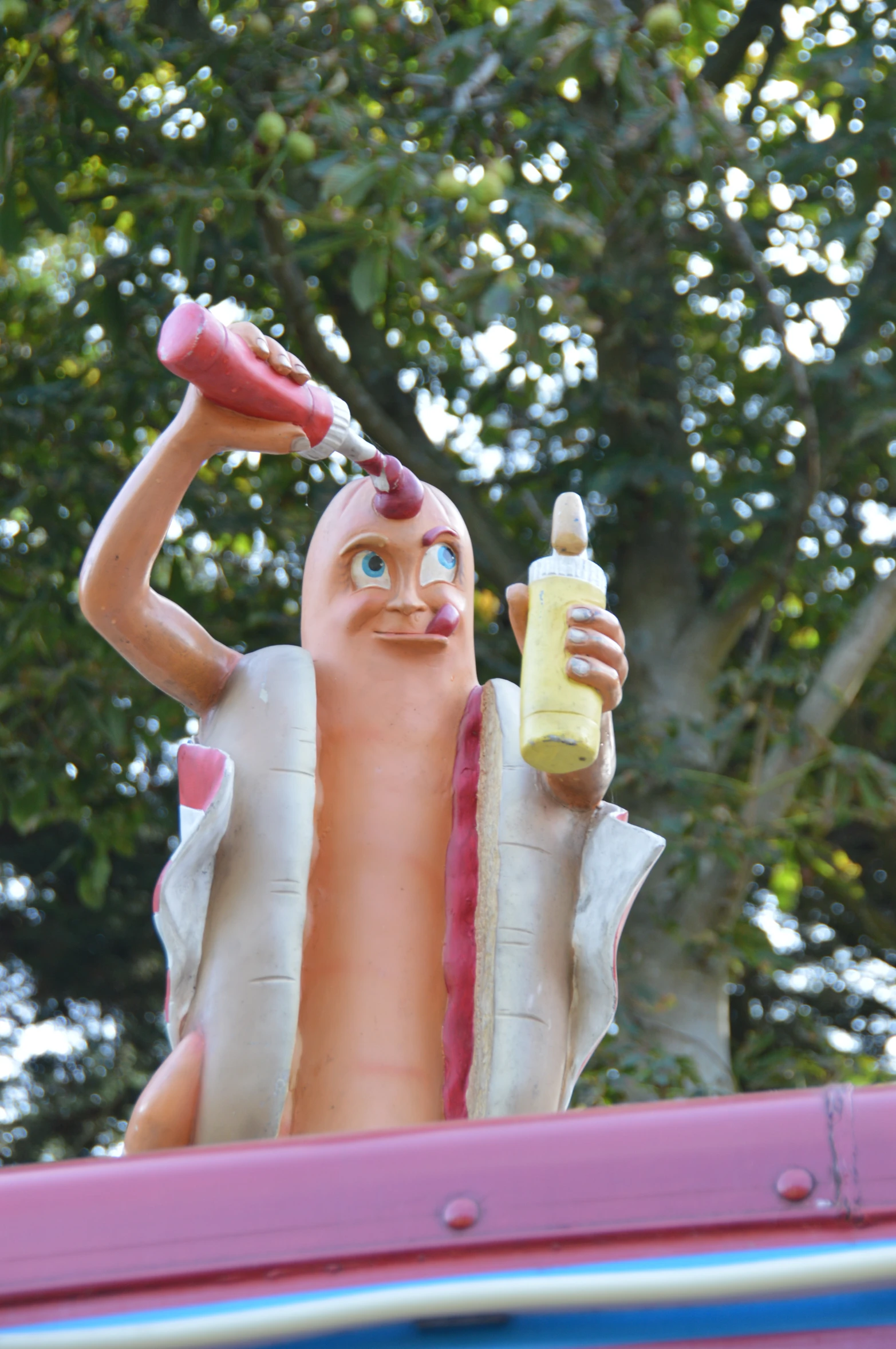 the statue is posed as a  dog and mustard