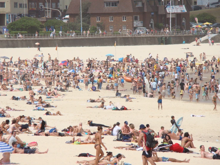 several people on the beach with a lot of sand