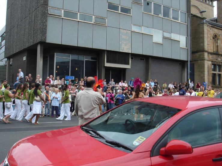 a crowd of people are gathered near the street