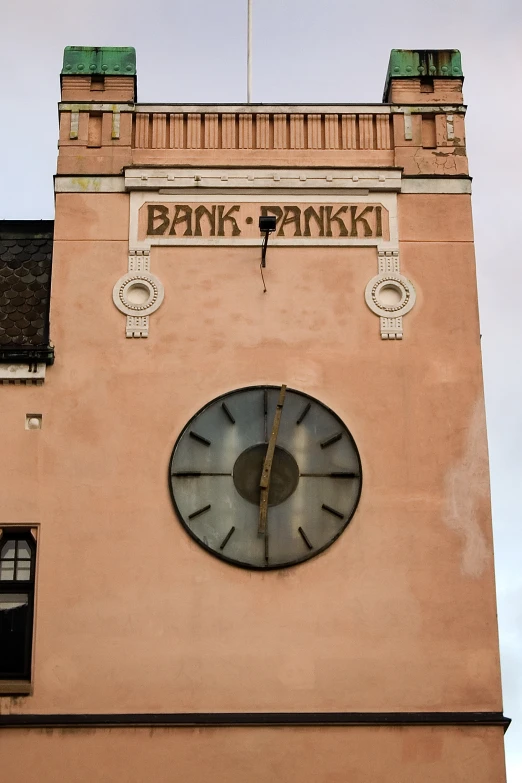 a clock is at the top of a building