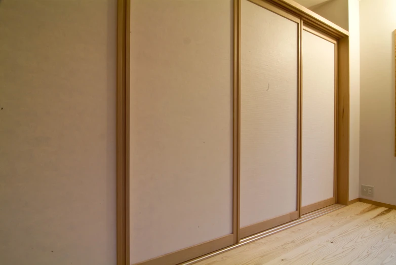 a large room with some sliding doors on the wall