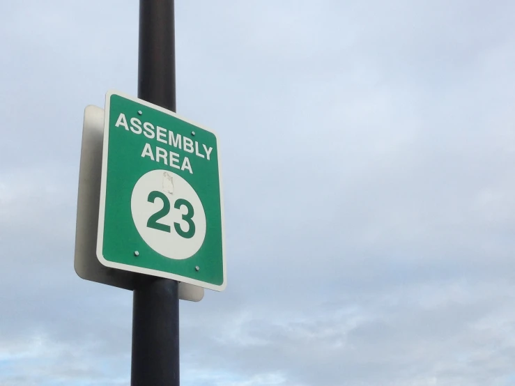 green street sign on top of a metal pole