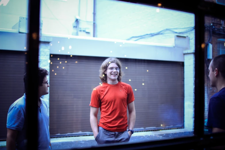 a man standing in front of a garage door