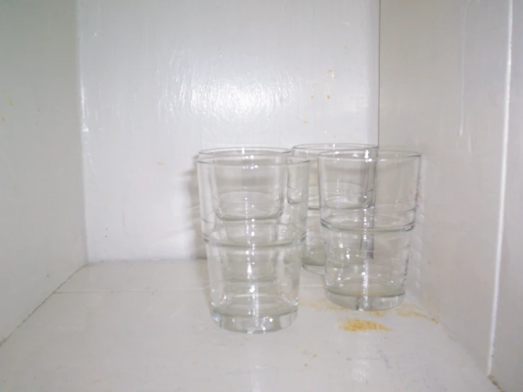 a group of small glasses that have been sitting on a table