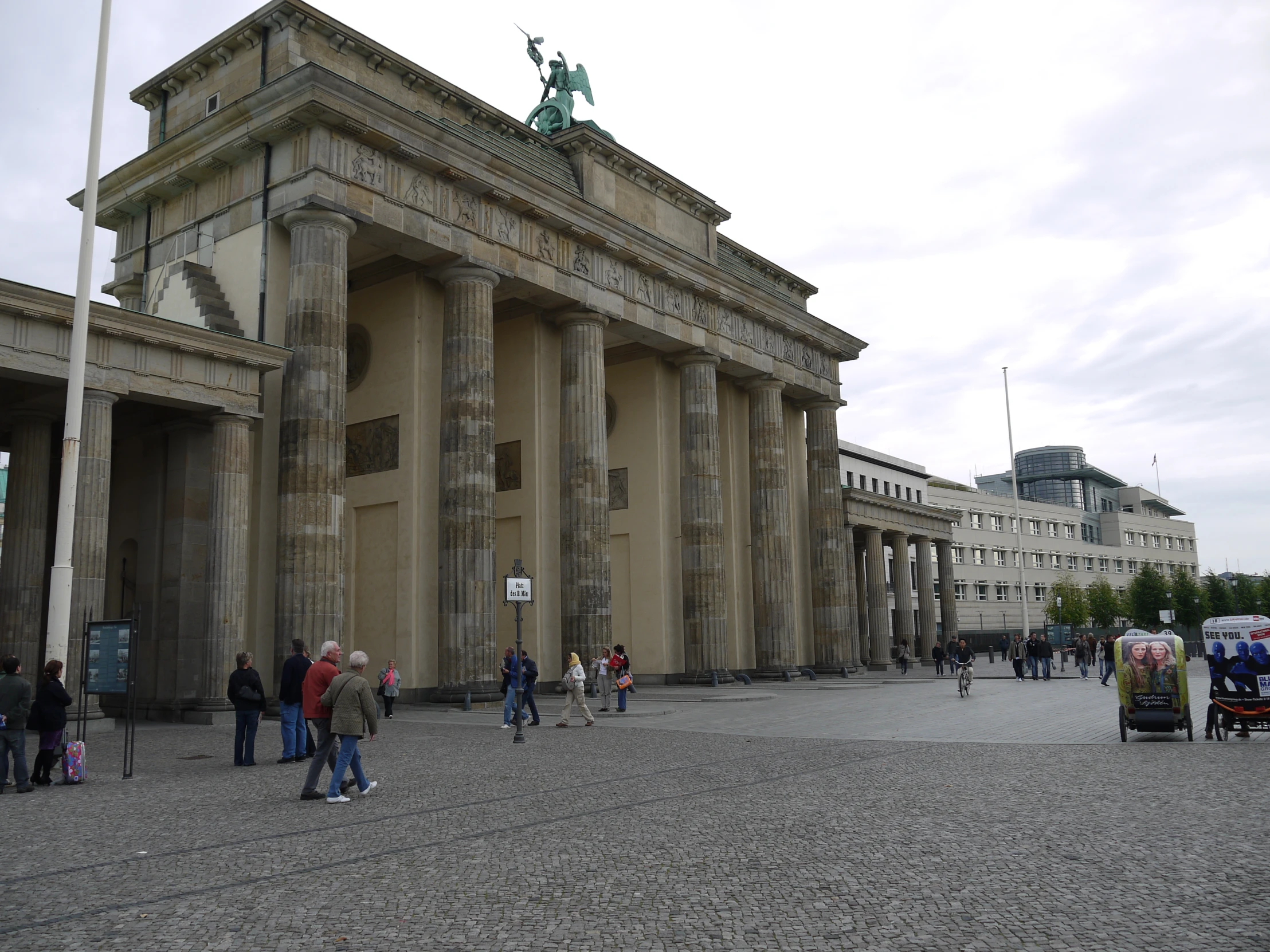 people standing in front of an old building