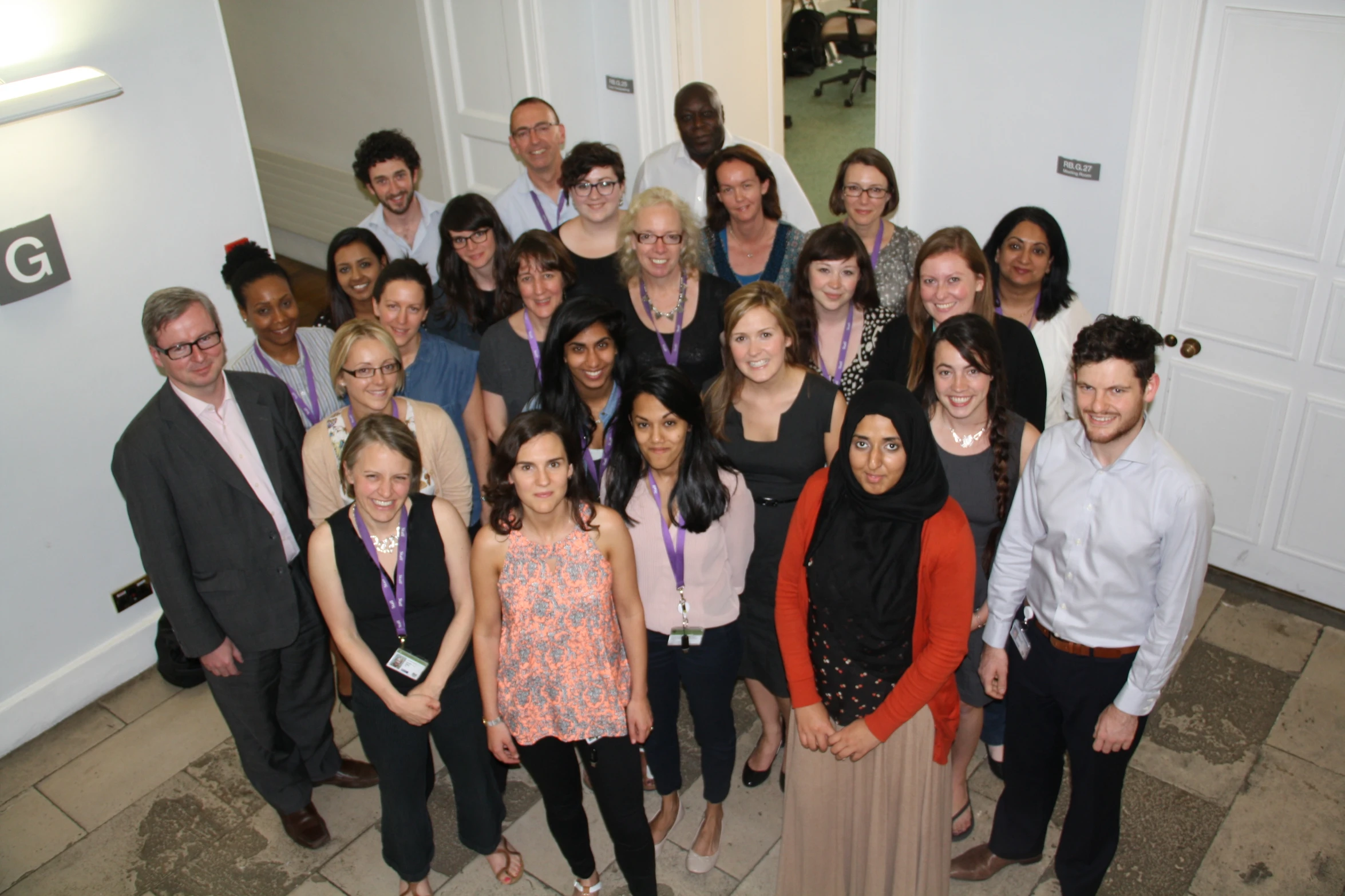 a group of people in front of a door