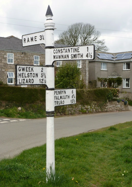 a pole has four road signs attached to it