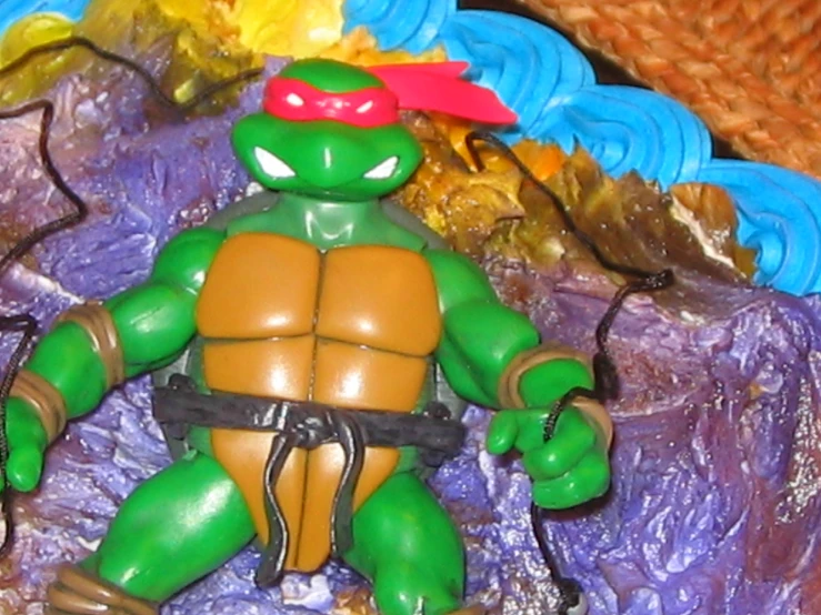 a close up of a turtle toy on a table