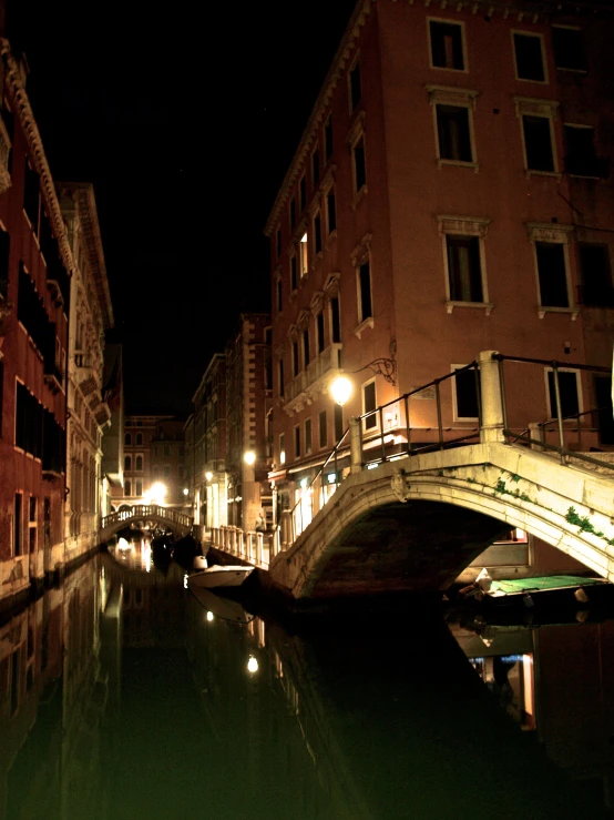 a city at night with a gondola suspended above