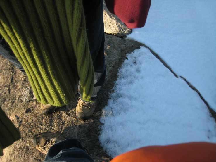 view from above as someone with their feet up next to the snow