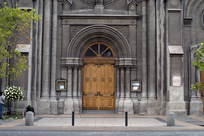 a wooden door sits in front of an ornate church