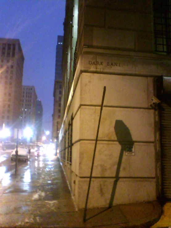 a picture of a street scene with lights and rain