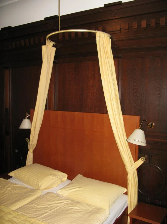 a double bed with canopy in a room