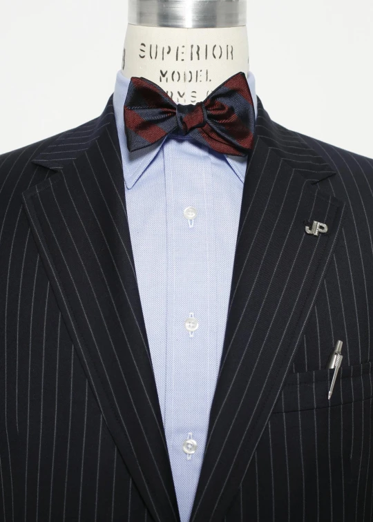 a jacket and tie with stripes on a mannequin head