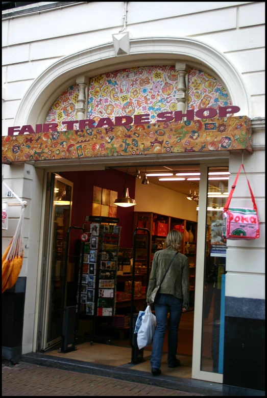 the storefront of the retail area shows a person entering