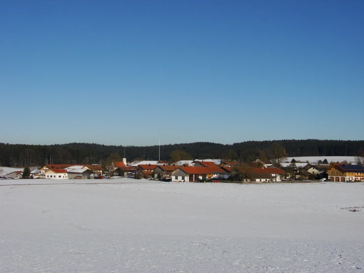 the town is in a line with some trees