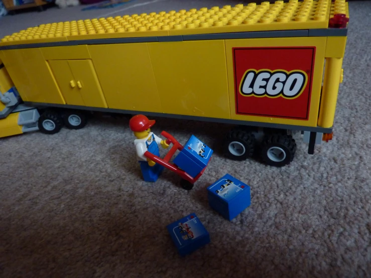 a toy train car on the floor and some other toys