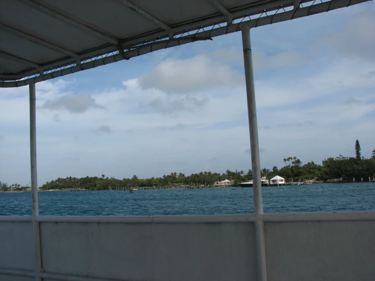 the coast and water at the island with white buildings