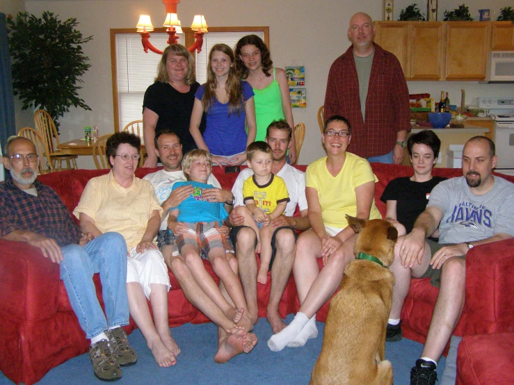 a group of people sitting in a living room together