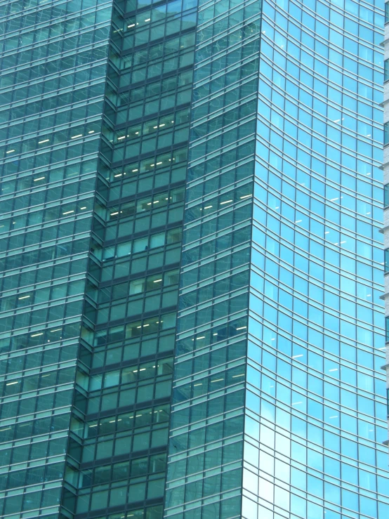 an image of two very tall buildings that have been painted blue