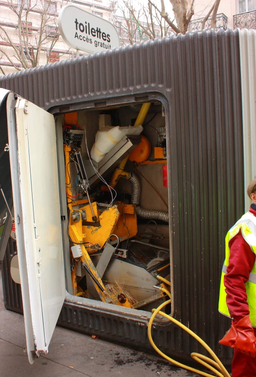 a man is loading up an open delivery truck