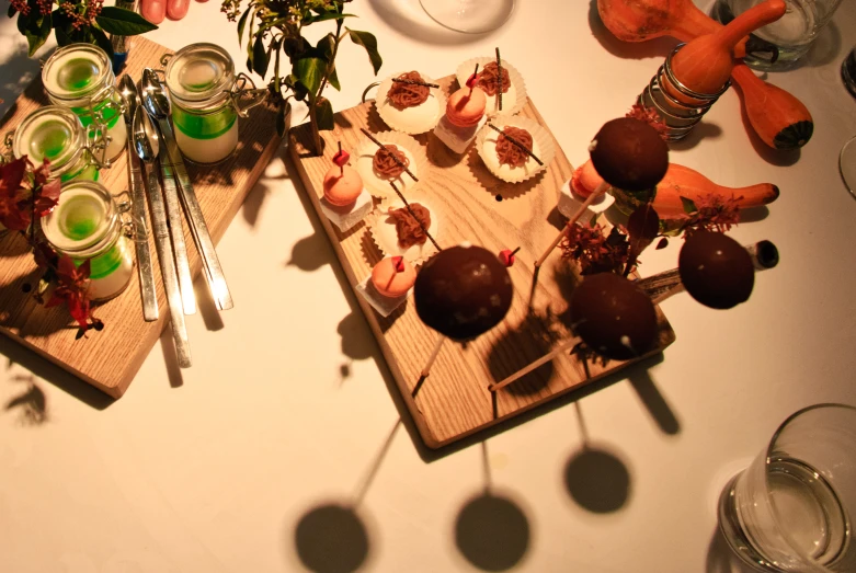 table filled with food and candles on wooden tray