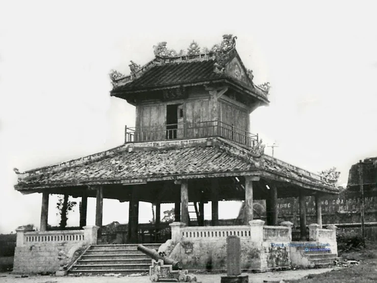 a black and white image of a chinese house in the middle of a city