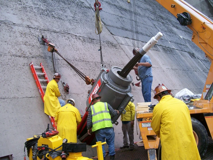 some construction workers that are fixing a structure