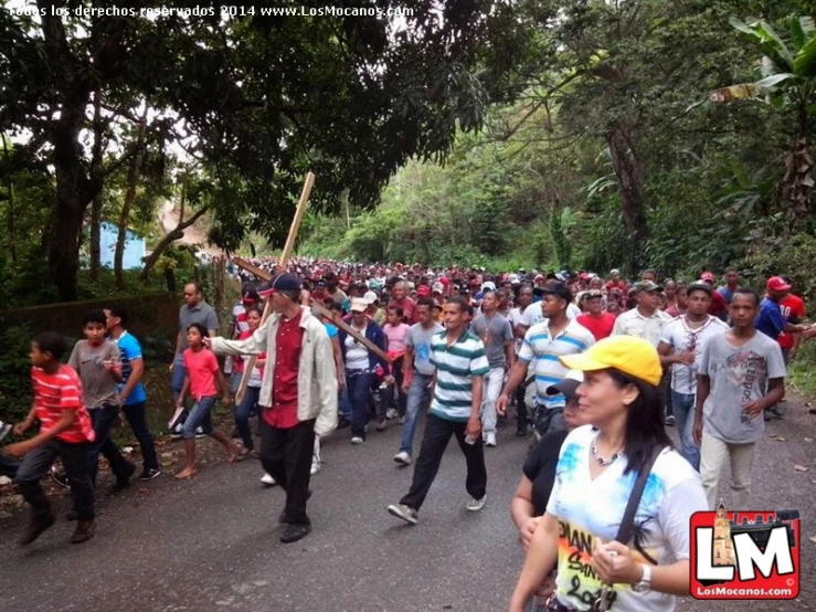 a group of young people on a road in a forest