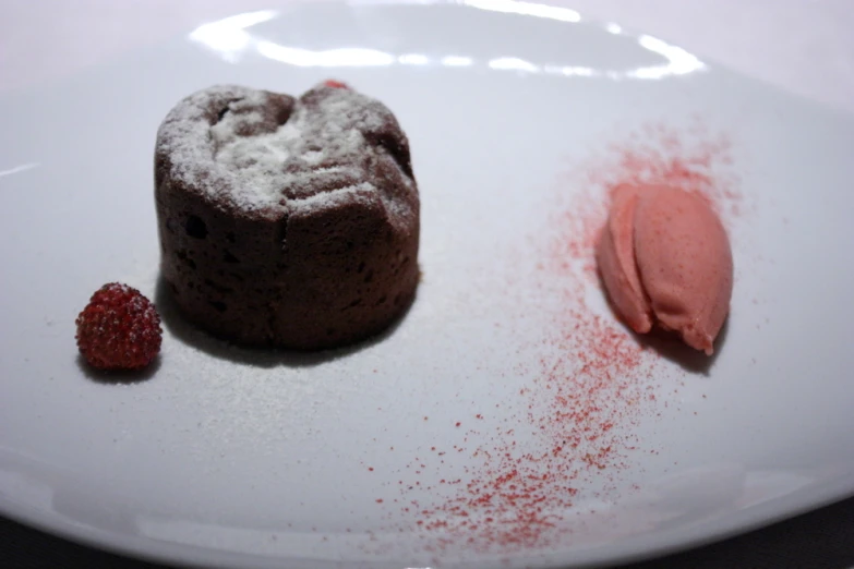 chocolate cake next to pinkish cake on plate