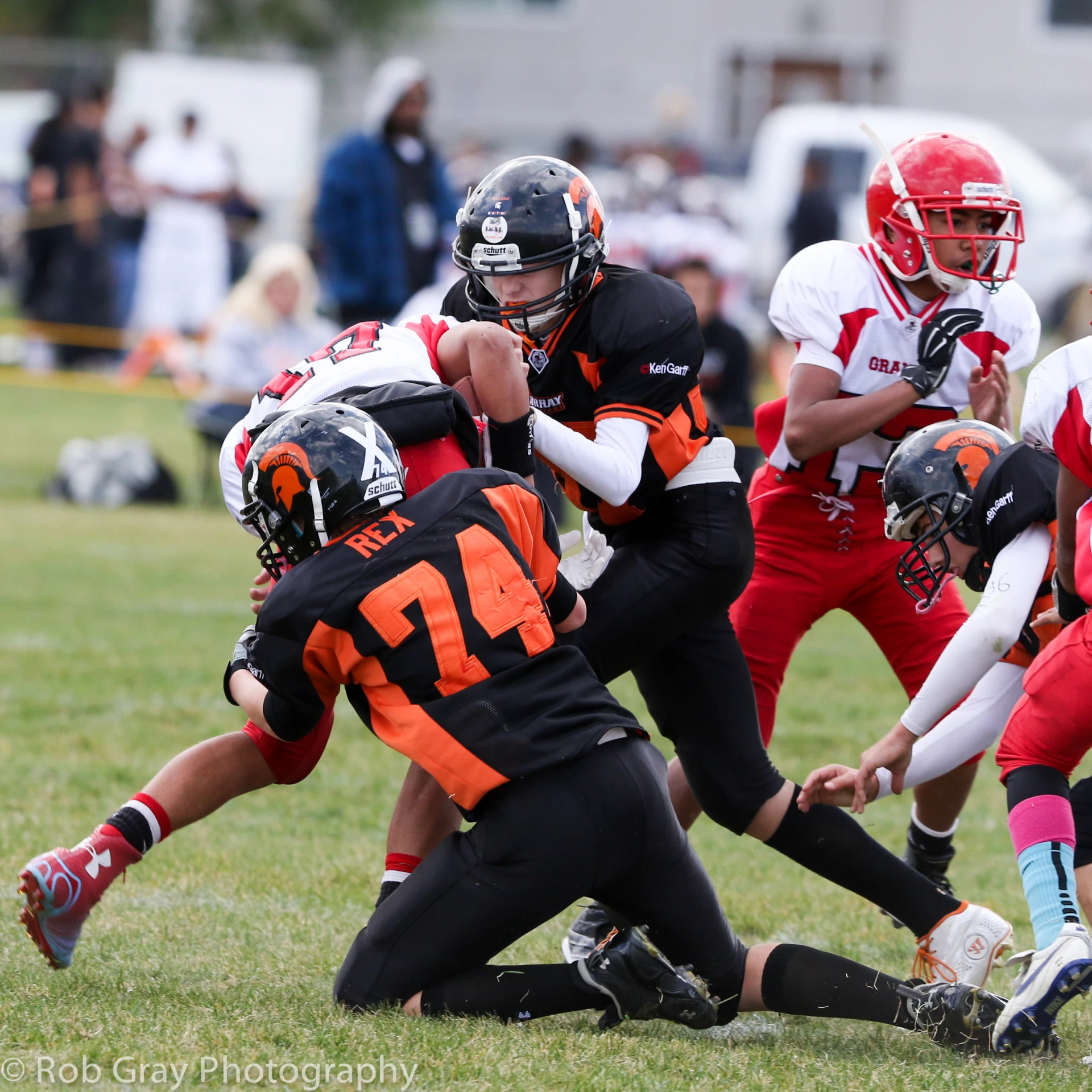 the young man is running through a game of football