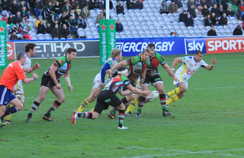 a group of young men playing a game of rugby