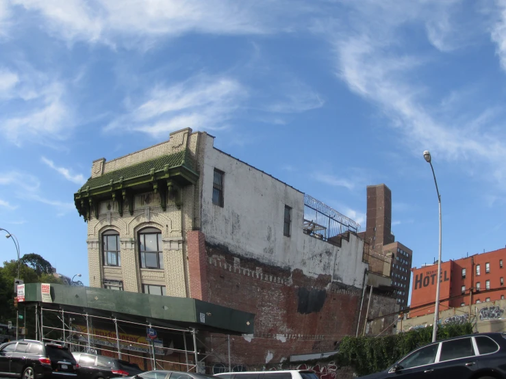 a tall building sitting on the side of a street