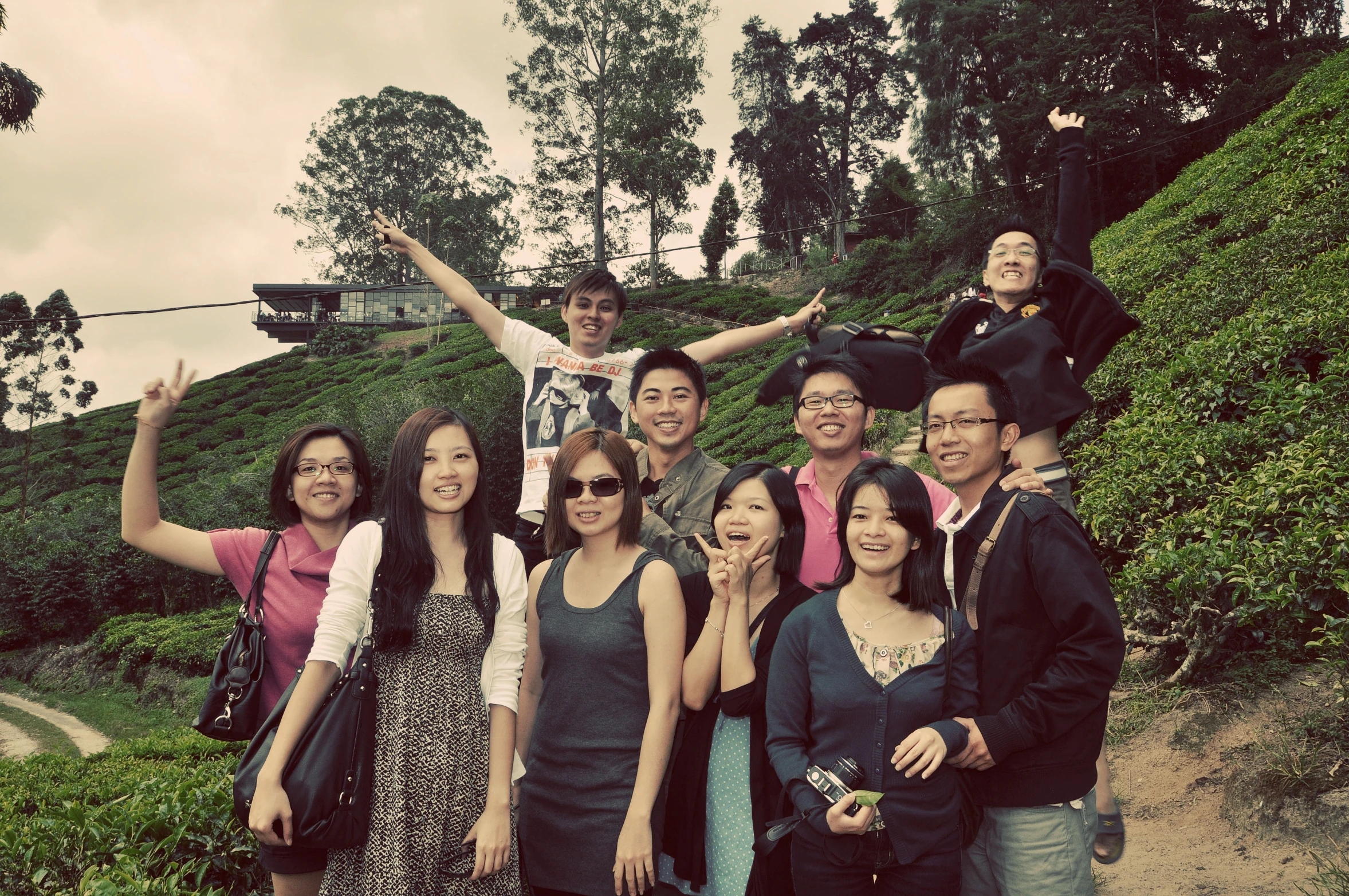 a group of people are posing on some steps