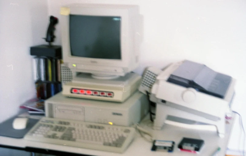 the old computer is on top of the other computer items