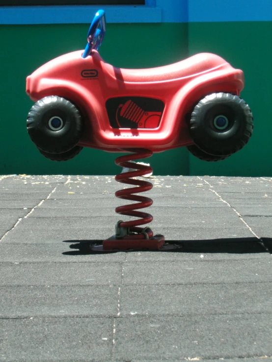 a toy vehicle that is sitting on some cement