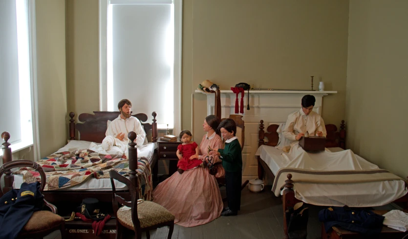 a family prepares to complete their big day in a bedroom